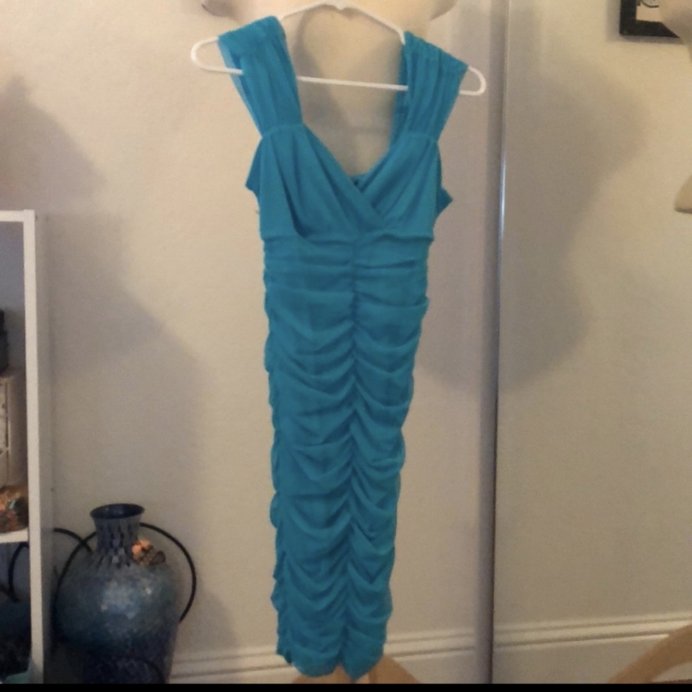 Sofia Vergara turquoise. Ruched dress